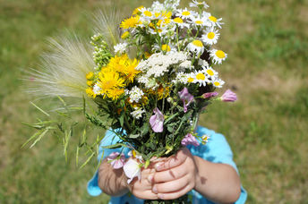 Child with flowers.