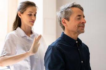 A man receives a healing reiki treatment.