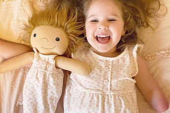 Girl playing with her customized doll thanks to Amy Jandrisevits of A Doll Like Me