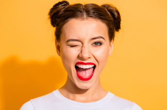 Portrait of a funny lady winking.