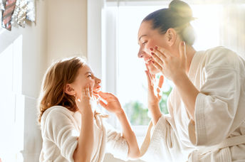 Mother and daughter with healthy skin.