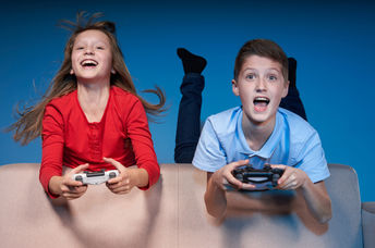 Kids having fun playing a video game.