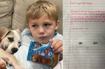 Roman and Maggie next to one of the letters.