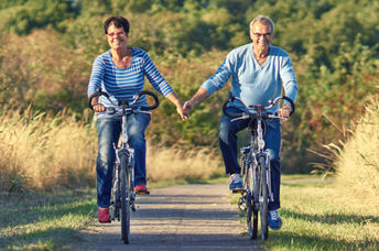 Biking outdoors like this couple is a great way to increase mitochondria.