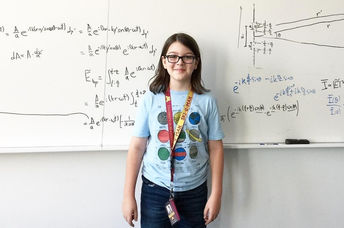 Elliott Tanner presents a physics calculation.