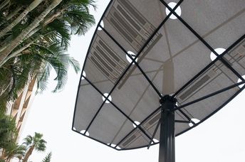 LumiWeave fabric shades by day and uses sun to light at night.