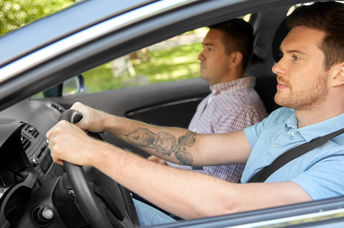 Two people in a car.