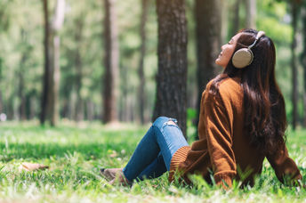 A woman with headphones.