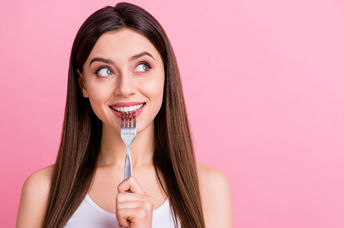 A young woman dreaming about food.