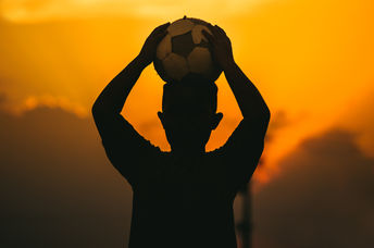 A child holding a soccer ball.