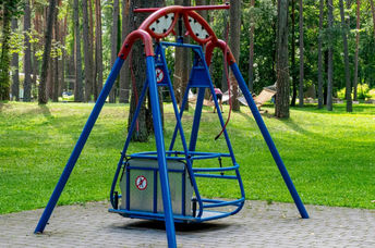 Wheelchair accessible swing in a park.