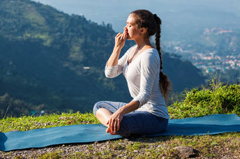 Woman practicing breathing exercises.