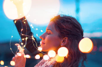 Woman holding fairy lights