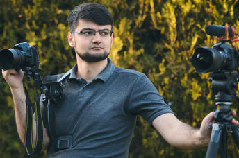 A videographer with two cameras.