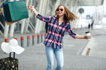 A woman dancing at the airport.