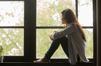 Depressed teenager spending time alone.