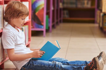 Cute boy with a book.