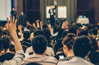 A lecture in a conference hall.