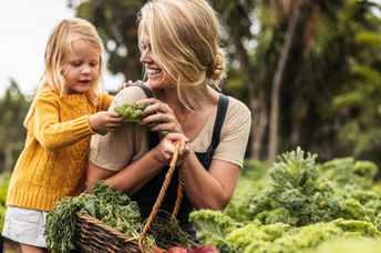 A mother and child in an organic garden.