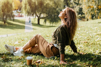Woman relaxing in nature during her lunch break.