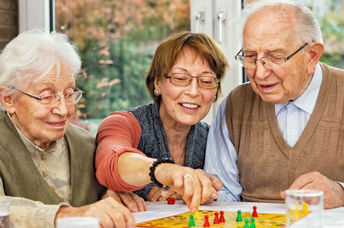 Parents and daughter playing a board game.