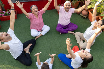 a group of people doing laughing yoga.