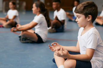 Students learning mindfulness in school.