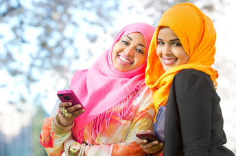 Two young Somali women using an app.