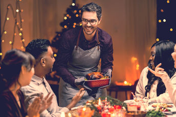 Friends enjoying Christmas dinner together.