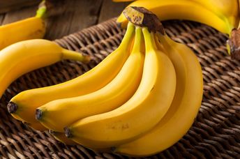 A  bunch of organic yellow bananas.
