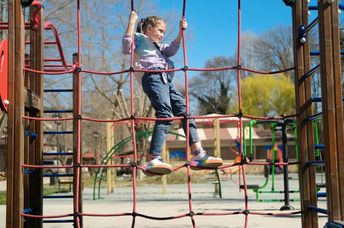 A child playing in an urban park.
