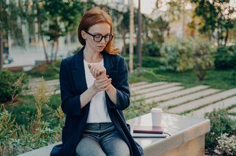 A woman checking her heart rate.