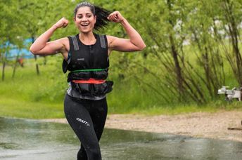 Woman walking with a weighted vest.
