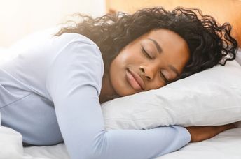A young woman is getting restful sleep.