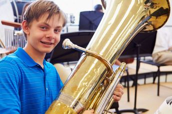 Student playing a tuba.