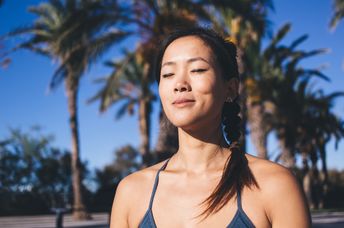 A woman with closed eyes rests.