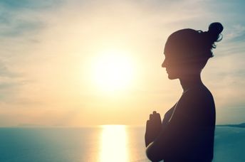 Woman meditating in nature.