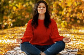 Woman meditating in nature.