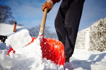Shoveling snow from sidewalks.