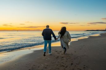 Strolling by the shore at twilight.