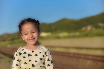 An Arab girl smiles sweetly.