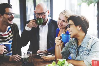 People meet together in a coffee shop.