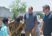 White and Damon meeting members of small communities in India (Water.org)