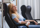 Woman donating blood.