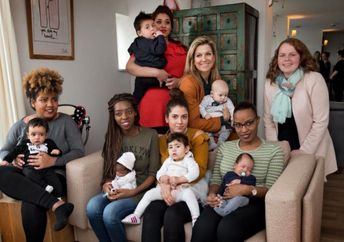 Queen Máxima of the Netherlands sits with young mothers at the Baby House in Dordrecht