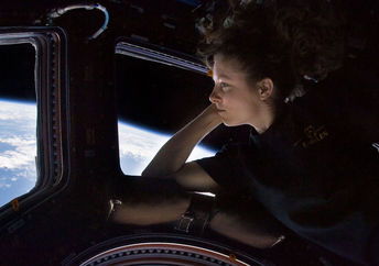 Caldwell Dyson in the Cupola module of the International Space Station observing Earth.