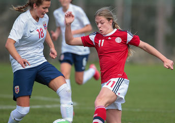 Andrea Norheim (#18 Norway) and Freja Kjaersig Sunesen (#11 Denmark) fight for the ball during a UEFA women's U17 qualifying game