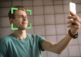Man scanning face with smartphone