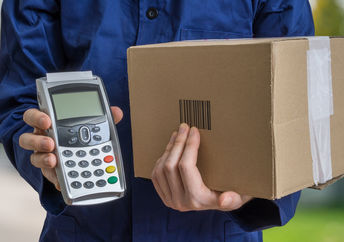 Delivering packages using amazon electric vans.