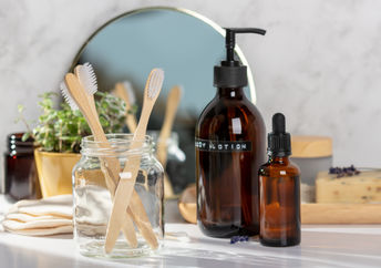 An eco-friendly bathroom with toothbrushes and DIY beauty products.